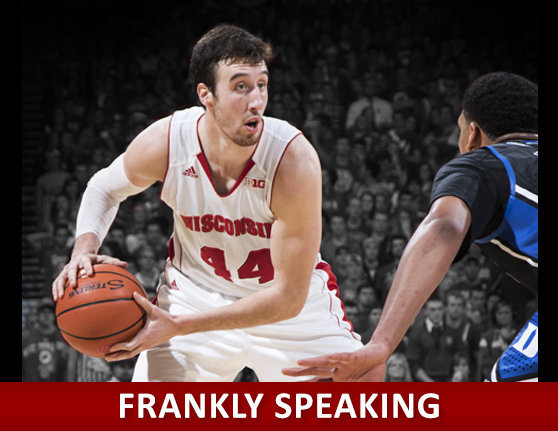 Frankly Speaking - An action shot of Frank holding a ball accross from an opposing player on the court.